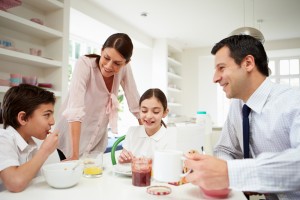 Busy family prepares for work and school in the morning